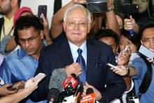 Malaysia's former Prime Minister Najib Razak prepares to speak to journalists as he leaves a court in Kuala Lumpur, Malaysia, September 20, 2018. PHOTO BY REUTERS/Lai Seng Sin