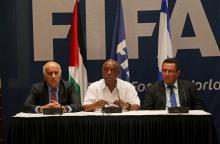 Jibril Al Rajoub (L), President of the Palestinian Football Association, Tokyo Sexwale (C), chairman of the FIFA Monitoring Committee Israel-Palestine and Israel Football Association president Ofer Eini attend a news conference in the West Bank city of Jericho, December 16, 2015. PHOTO BY REUTERS/Mohamad Torokman