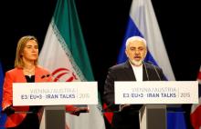 Iranian Foreign Minister Mohammad Javad Zarif addresses during a joint news conference with High Representative of the European Union for Foreign Affairs and Security Policy Federica Mogherini (L) after a plenary session at the United Nations building in Vienna, Austria, July 14, 2015. PHOTO BY REUTERS/Leonhard Foeger