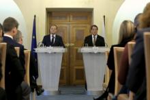 European Council President Donald Tusk (L) and Cyprus' President Nicos Anastasiades attend a news conference after their meeting at the Presidential Palace in Nicosia, Cyprus, March 15, 2016. PHOTO BY REUTERS/Petros Karadjias