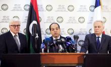 A member of the Presidential Council of Government of National Accord, Ahmed Maiteeq (C) stands next to German Foreign Minister Frank-Walter Steinmeier (L) and French Foreign Minister Jean-Marc Ayrault (R) dueing a joint news conference in Tripoli, Libya, April 16, 2016. REUTERS/Ismail Zitouny