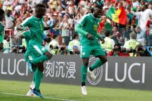 Senegal's M'Baye Niang celebrates scoring their second goal with Idriss Gueye. PHOTO BY REUTERS/Grigory Dukor