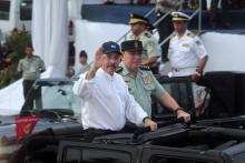 Nicaragua's President Daniel Ortega (L) salutes next to Commander in Chief of the Army of Nicaragua, General Julio Cesar Aviles