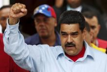 Venezuela's President Nicolas Maduro gestures while he attends a rally against the opposition's amnesty law at Miraflores Palace in Caracas, April 7, 2016. PHOTO BY REUTERS/Carlos Garcia Rawlins
