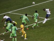 France's Paul Pogba (19) heads to score a goal against Nigeria during their 2014 World Cup round of 16 game at the Brasilia national stadium in Brasilia, June 30, 2014. PHOTO BY REUTERS/David Gray