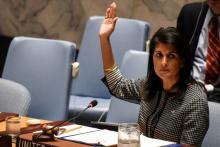 U.S. Ambassador to the U.N. Nikki Haley votes for a draft resolution condemning the reported use of chemical weapons in Syria at the Security Council meeting on the situation in Syria at the United Nations Headquarters in New York, U.S., April 12, 2017. PHOTO BY REUTERS/Stephanie Keith