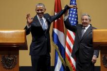 President Barack Obama and Cuban President Raul Castro gesture after a news conference as part of Obama's three-day visit to Cuba, in Havana, March 22, 2016. PHOTO BY REUTERS/Carlos Barria