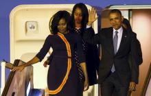 U.S. President Barack Obama and First Lady Michelle Obama (L) arrive for their visit to Argentina with their daughters Malia (C) and Sasha at Buenos Aires' international airport, early, March 23, 2016. PHOTO BY REUTERS/Marcos Brindicci