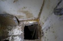 A view of the opening of a tunnel, which is connected to a warehouse, inside drug lord Joaquin "El Chapo" Guzman's cell in the Altiplano Federal Penitentiary, where he escaped from, in Almoloya de Juarez, on the outskirts of Mexico City, July 15, 2015. PHOTO BY REUTERS/Edgard Garrido