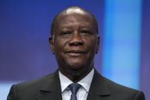 President of Ivory Coast Alassane Ouattara sits on stage in support of a commitment to stop poaching of African elephants announced at the Clinton Global Initiative (CGI) in New York