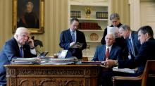 President Donald Trump (L-R), joined by Chief of Staff Reince Priebus, Vice President Mike Pence, senior advisor Steve Bannon, Communications Director Sean Spicer and then National Security Advisor Michael Flynn, speaks by phone with Russia's President Vladimir Putin in the Oval Office. PHOTO BY REUTERS/Jonathan Ernst