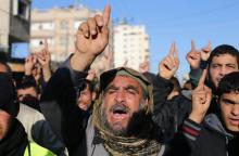 Palestinians chant slogans during a protest against the decision of an Egyptian court to list Hamas's armed wing as a terrorist organization, in Rafah near the border between southern Gaza Strip and Egypt, February 5, 2015. PHOTO BY REUTERS/Ibraheem Abu Mustafa
