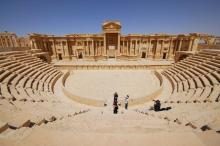 Tourists take pictures at the ancient Palmyra theater in the historical city of Palmyra, Syria in this April 18, 2008 file photo. PHOTO BY REUTERS/Omar Sanadiki