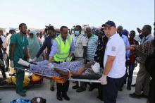 Paramedics assist a civilian injured during an explosion last Saturday in KM4 street in the Hodan district to board a Turkish military plane for medical evacuation at the Aden Abdulle International Airport in Mogadishu, Somalia, October 16, 2017. PHOTO BY REUTERS/Feisal Omar