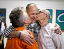 Australian journalist Peter Greste (C) receives a kiss from his mother Lois (L) and father Juris upon his return home at Brisbane International Airport, early February 5, 2015. PHOTO BY REUTERS/Nathan Richter