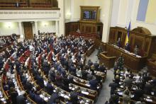 Parliamentary deputies applaud after a renouncing of Ukraine's "non-aligned" status during a session of a parliament in Kiev, December 23, 2014. PHOTO BY REUTERS/Alex Kuzmin