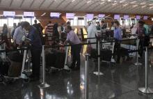 Passengers wait to have their luggage checked at Hamad International Airport in Doha, Qatar, June 7, 2017. PHOTO BY REUTERS/Naseem Zeitoon