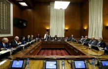 Asaad Al-Zoubi (R), head of the Syrian opposition delegation, and Salim al-Muslat (2nd R), spokesman for the High Negotiations Committee (HNC), attend peace talks with U.N. mediator for Syria Staffan de Mistura (2nd L) at the United Nations in Geneva, Switzerland, February 1, 2016. PHOTO BY REUTERS/Denis Balibouse
