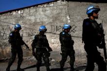 U.N. peacekeepers walk along a street during a patrol with Haitian national police officers and members of UNPOL (United Nations Police) in the neighborhood of Cite Soleil, in Port-au-Prince, Haiti, March 3, 2017. PHOTO BY REUTERS/Andres Martinez Casares