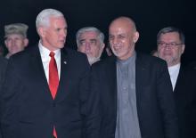 U.S. Vice President Mike Pence walks past an honour guard with Afghan President Ashraf Ghani and Chief Executive Abdullah Abdullah upon arrival at the Presidential Palace in Kabul, Afghanistan, December 21, 2017. PHOTO BY REUTERS/Mandel Ngan