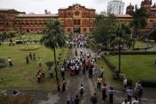 People visit the Ministers' Building, formerly known as the Secretariat Builidng, where General Aung San and eight others were assassinated, during an event marking the anniversary of Martyrs' Day in Yangon July 19, 2015. PHOTO BY REUTERS/Soe Zeya Tun