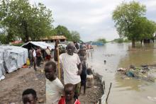 People stand next to makeshift structures after heavy rains and floods forced hundreds of thousands of people to leave their homes, in the town of Pibor, South Sudan, November 6, 2019. PHOTO BY REUTERS/Stephen Tekajuok
