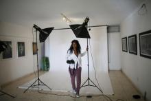 A photographer prepares the set for a photoshoot at the studio of the digital magazine Vistar in Havana, Cuba, August 11, 2016. PHOTO BY REUTERS/Alexandre Meneghini