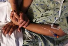 A patient is comforted by her husband at St. Joseph's Hospital in Tucson, Arizona, U.S. September 13, 2017. They were enrolled in health insurance thanks to Maria Losoya, a University of Arizona Center for Rural Health Navigator. PHOTO BY REUTERS/Caitlin O'Hara