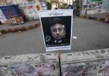 A placard of former President Pervez Musharraf is left behind by his supporter after a protest demanding a fair trial for him in Karachi, March 9, 2014. PHOTO BY REUTERS/Akhtar Soomro