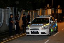 Police arrive outside former prime minister Najib Razak's residence in Kuala Lumpur, Malaysia, May 16, 2018. PHOTO BY REUTERS/Lai Seng Sin