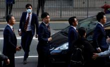 Five of the seven police officers, charged in connection with the beating of a protester during Occupy Central pro-democracy demonstrations, arrive at a court in Hong Kong, China, February 14, 2017. PHOTO BY REUTERS/Bobby Yip