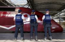 Belgian police officers stand guard on a platform at the Thalys high-speed train terminal at Brussels Midi/Zuid railway station, August 22, 2015. PHOTO BY REUTERS/Francois Lenoir