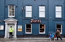 A police officer stands outside a restaurant which was closed after former Russian inteligence officer Sergei Skripal, and a woman were found unconscious on a bench nearby after they had been exposed to an unknown substance, in Salisbury, Britain, March 6, 2018. PHOTO BY REUTERS/Toby Melville