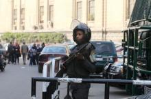 A member of the riot police stands guard outside the high court in Cairo, Egypt, January 21, 2016. PHOTO BY REUTERS/Mohamed Abd El Ghany