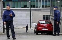 Belgian police officers secure the departure of Salah Abdeslam, the most-wanted fugitive from November's Paris attacks, from the federal police headquarters in Brussels, March 19, 2016, after he was arrested after a shootout with police in Brussels on Friday. PHOTO BY REUTERS/Francois Lenoir