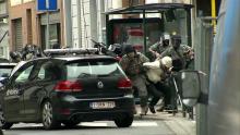 Armed Belgian police apprehend a suspect, in this still image taken from video, in Molenbeek, near Brussels, Belgium, March 18, 2016. PHOTO BY REUTERS/VTM via Reuters Tv TPX
