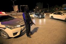 A member of the Special Deterrence Force stands near a car at a checkpoint in Tripoli, Libya March 7, 2016. PHOTO BY REUTERS/Ismail Zitouny