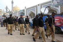 Policemen gather outside the tomb of Sufi saint Syed Usman Marwandi, also known as the Lal Shahbaz Qalandar shrine, after Thursday's suicide blast in Sehwan Sharif, Pakistan's southern Sindh province, February 17, 2017. PHOTO BY REUTERS/Akhtar Soomro