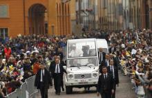 Pope Francis waves to the faithful from popemobile as he arrives to celebrate a Holy Mass in Carpi, Italy, April 2, 2017. PHOTO BY REUTERS/Alessandro Garofalo