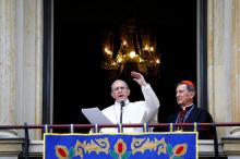 Pope Francis, flanked by Bogota archbishop Ruben Dario Salazar, addresses the audience from the balcony of the Cardinal Palace in Bogota, Colombia, September 7, 2017. PHOTO BY REUTERS/Nacho Doce