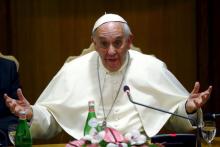Pope Francis gestures as he speaks during the "Modern Slavery and Climate Change" conference at the Vatican, July 21, 2015. PHOTO BY REUTERS/Tony Gentile