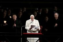 Pope Francis delivers his speech as he leads the "Via Crucis" (Way of the Cross) procession, which commemorates the crucifixion of Jesus Christ at the Colosseum in Rome, March 25, 2016. PHOTO BY REUTERS/Max Rossi