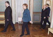 (L to R) Ukraine's President Petro Poroshenko, German Chancellor Angela Merkel, Russia's President Vladimir Putin and Italy's Prime Minister Matteo Renzi arrive for a meeting on the sidelines of a Europe-Asia summit (ASEM) in Milan