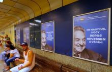 Hungarian government poster portraying financier George Soros and saying "Don't let George Soros have the last laugh" is seen at an underground stop in Budapest, Hungary, July 11, 2017. PHOTO BY REUTERS/Laszlo Balogh