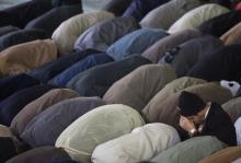 Iranian worshippers pray during Eid al-Adha prayers at a university in Tehran, November 28, 2009. PHOTO BY REUTERS/Morteza Nikoubazl