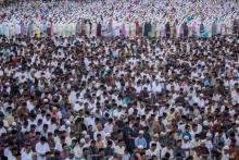 Muslims perform Eid al-Fitr prayers in the Tugu Pahlawan, Surabaya, East Java, Indonesia June 25, 2017 in this photo taken by Antara Foto. PHOTO BY REUTER/Moch Asim
