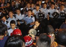 Police react as they are about to disperse pro-democracy protesters off a vehicle tunnel near the government headquarters in Hong Kong