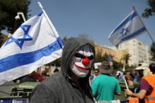 Protestors shout slogans during a demonstration outside the Israeli Prime Minister's residency in Jerusalem, March 2, 2018. PHOTO BY REUTERS/Ammar Awad