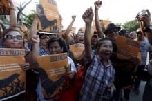 Demonstrators from the New Democracy Movement (NDM) takes part in a rally at the Democracy Monument in Bangkok, Thailand, September 19, 2015. PHOTO BY REUTERS/Chaiwat Subprasom