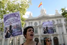 Women gather outside the Supreme Court after Spain's top court found five men known as the "Wolf Pack" guilty of rape in Madrid, Spain, June 21, 2019. The banner reads: It's not abuse, it's rape. PHOTO BY REUTERS/Susana Vera